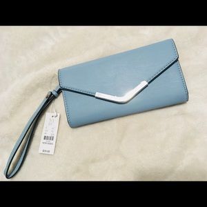 Baby blue wristlet wallet.